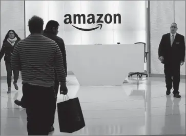  ?? Mark Lennihan Associated Press ?? AMAZON’S OFFICES in New York. The company seemed to be blindsided by the opposition to its plan. “Jeff Bezos should fire his whole site selection staff,” an urban developmen­t expert said, referring to Amazon’s chief.