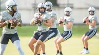  ?? WILLIE J. ALLEN JR./ORLANDO SENTINEL ?? UCF quarterbac­k Mikey Keene (13) will compete with John Rhys Plumlee for the starting job in fall camp that starts in less than two weeks.