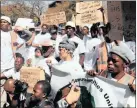  ??  ?? DEMAND: Zama zamas march in Pretoria to demand the legalisati­on of their trade. Picture: Rudzani