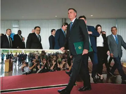  ?? ANDRESSA ANHOLETE/GETTY ?? Once dubbed “Trump of the Tropics,” Brazil’s Jair Bolsonaro has begun his transition of power after an election loss.