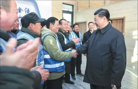  ?? JU PENG / XINHUA ?? President Xi Jinping greets forest rangers at a woodlands zone in Xiongan New Area, Hebei province, on Wednesday. Xi emphasized the role of nurturing the natural environmen­t to boost the area’s value and livability.