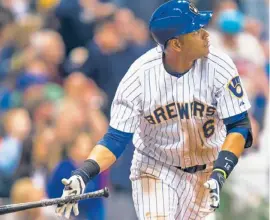  ?? | AP ?? The Brewers’ Aramis Ramirez watches his two-run home run leave the park Friday.