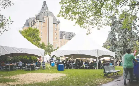  ?? LIAM RICHARDS FILES ?? Wet weather had people taking cover under tents at the Taste of Saskatchew­an in July. The disappoint­ing outcome was a factor in the decision to take at least one year off.