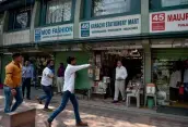  ?? — PTI ?? Protesters force shopkeeper­s to close their shops at Janpath in New Delhi on Monday.