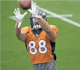  ?? Andy Cross, The Denver Post ?? Broncos tight end Nick Vannett ( 88) makes a catch in a drill during training camp at Empower Field at Mile High on Saturday.