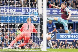  ?? Photo / AP ?? An athletic Chris Wood didn’t score, but his Burnley beat Everton.