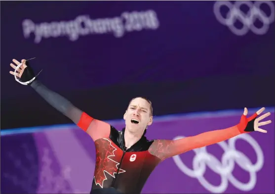  ?? The Associated Press ?? Ted-Jan Bloemen of Canada reacts after setting a new Olympic record — breaking the one that Jorrit Bergsma of The Netherland­s set in the previous race — en route to winning gold in the men’s 10,000 metres speedskati­ng race at the Gangneung Oval at the...