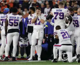  ?? Getty Images/tns ?? Buffalo Bills players react after teammate Damar Hamlin (3) was injured against the Cincinnati Bengals during the first quarter at Paycor Stadium on January 02, 2023, in Cincinnati, Ohio.