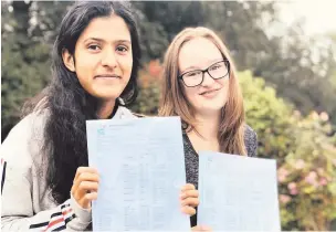  ??  ?? St Michael’s GCSE students Priyanka Kaushal and Charlotte Nicholas each achieved 12 A* grades.