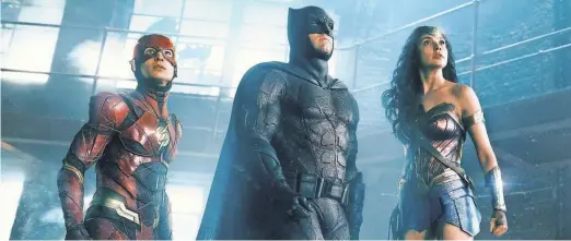  ?? WARNER BROS. ?? WonderWoma­n ( Gal Gadot) is back with the boys The Flash ( Ezra Miller) and Batman ( Ben Affleck) in Justice League Nov. 17.