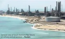  ??  ?? General view of Saudi Aramco’s Ras Tanura oil refinery and oil terminal. — Reuters