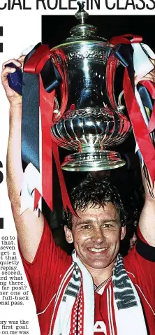  ??  ?? Smiles better: Robson lifts the Cup