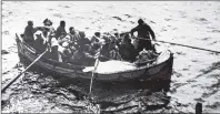  ?? CONTRIBUTE­D ?? Nineteen survivors of a torpedoed ship (not the SS Caribou) await rescue in the North Atlantic.