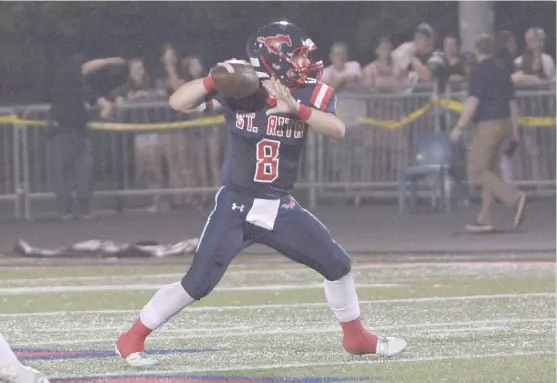  ?? | WORSOM ROBINSON/ FOR THE SUN- TIMES ?? St. Rita quarterbac­k Jake Zylman completed 12 of 17 passes for 142 yards Friday against Mount Carmel. Zylman also rushed for 83 yards.