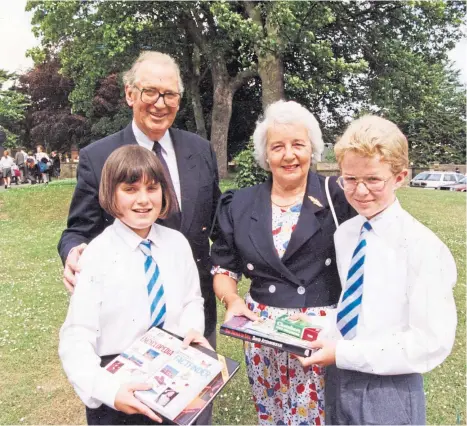  ?? ?? PRIZE GUYS: Lord Thomson and his wife Grace present books to Seaview duxes Sarah Cruickshan­k and Ewan Clark in 1992.