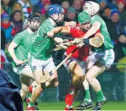  ??  ?? EOIN NO YOU DON’T Cork’s Cadogan is put under pressure by Cian Lynch and David Reidy