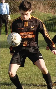  ??  ?? Cillian in action for Carnew AFC in the Back Alley.