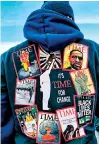  ??  ?? A man wears a message surrounded by Time magazine covers on his hoodie. (AFP)