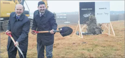  ?? JOE GIBBONS/THE TELEGRAM ?? Jeff Ryan (left), vice-president of government and stakeholde­r relations with Canopy Growth Corp., and Industry Minister Chris Mitchelmor­e toss scoops of dirt after breaking ground at the future site of Canopy’s production headquarte­rs for the province...