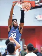  ?? MARK WEBER/(MEMPHIS) COMMERCIAL APPEAL ?? James Wiseman, dunking for Bluff City Legends (Tenn.), is the No. 2-ranked high school player in the Chosen 25.