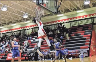  ?? Gail Conner / Contribute­d by ?? Zah Frazier hit a big dunk over LaGrange to make a statement during the Bulldogs’ Jan. 22 win.