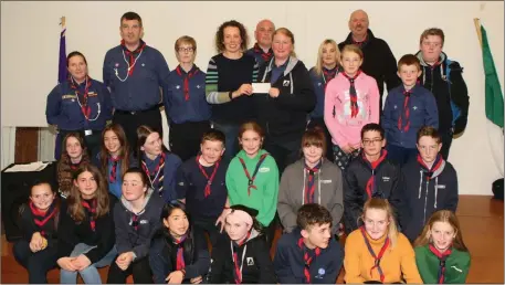  ??  ?? Assistant Project Manager of Focus Ireland Michelle Monaghan, receives a cheque for €800 from Duncannon Scouts.