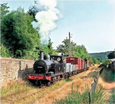  ??  ?? Former Staveley Iron Works ‘1F’ 0‑6‑0TNo. 41708 looks quite at home at the Dean Forest Railway, masqueradi­ng as former Gloucester shed ‘Half Cab’ No. 41748. The 1880 Midland Railway veteran bustles away from Whitecroft crossing on July 21 1994 in a delightful rural scene, devised by Sentimenta­l Journeys.