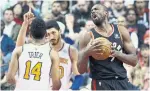  ?? RICK MADONIK TORONTO STAR ?? Raptors forward Serge Ibaka is happy with the call as New York Knicks centre Enes Kanter, back, raises his hand on the foul call.