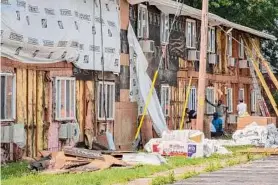  ?? Lori Van Buren/times Union ?? Constructi­on continues Wednesday on the buildings at Harbour Point Gardens where the residents of 58 apartments at the Troy complex were ordered from their homes June 22 after city officials deemed the apartments unsafe.