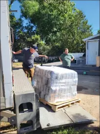  ?? SUBMITTED PHOTO ?? Pallets of pet food are unloaded in Medicine Hat prior to Animal Food Bank’s local launch.