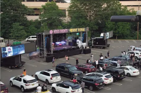  ?? Associated Press ?? Drive N’ Drag at Westfield Garden State Plaza, in Paramus, N.J. After being closed for months due to the pandemic, malls are bringing all types of drive-in entertainm­ent to their massive parking lots, hoping to lure people back to their properties.