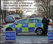  ?? JOSEPH RAYNOR ?? Edwards Lane, in Sherwood, was closed for a number of hours yesterday