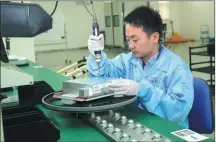  ?? PROVIDED TO CHINA DAILY ?? A technician works on a communicat­ion navigation system for the C919, the first Chinese-built passenger jet.