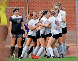  ?? THE OKLAHOMAN] [PHOTO BY SARAH PHIPPS, ?? Mustang celebrates a goal by sophomore forward Addie Arthur (10).