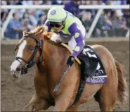  ?? GREGORY BULL - THE ASSOCIATED PRESS ?? FILE - In this Nov. 4, 2017, file photo, jockey Jose Ortiz rides Good Magic to victory in the Sentient Jet Juvenile horse race at the Breeders’ Cup in Del Mar, Calif.