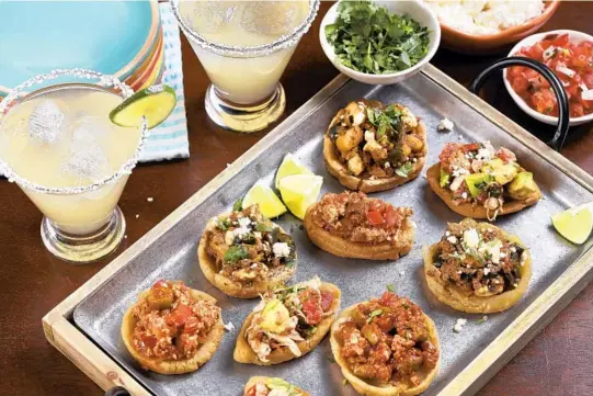  ?? ABEL URIBE/CHICAGO TRIBUNE PHOTOS; SHANNON KINSELLA/FOOD STYLING ?? Celebrate Cinco de Mayo with chalupas and sopes filled with chorizo and potato, tofu and chicken with avocado.