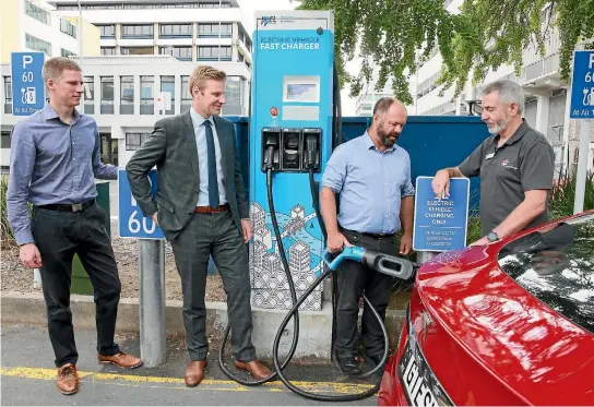  ?? MARK TAYLOR/STUFF ?? This Tesla Model S 90D was brought to Hamilton for an electric vehicle discussion organised by law firm Tompkins Wake. Pictured from left are: John Kinghorn from the Hamilton City Council’s transporta­tion unit, Tompkins Wake partner Campbell Stewart,...