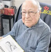  ?? TINA COMEAU ?? Yarmouth County resident Alcide LeBlanc, 99, with a photo of how he looked when he came home from the war. He turns 100 in March.