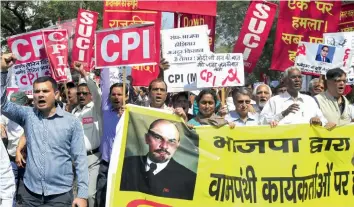  ?? — BUNNY SMITH ?? Activists of Left parties protest against attacks on statues and its cadre in New Delhi on Friday.