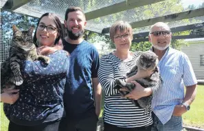  ?? PHOTO: ABBEY PALMER ?? Moving on . . . The soontobe owners of Invercargi­ll's Panda Cattery Courtney (left, holding Colin), and partner Karl Owen, are taking over from Denise, holding Grae, and David Chin Poy, after 56 years of the business being familyowne­d.