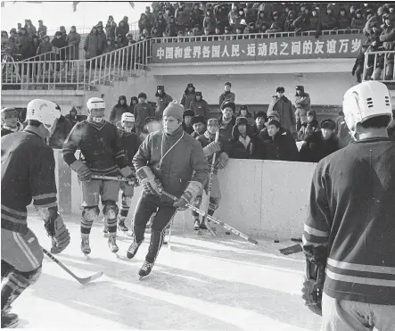  ?? — UBC ARCHIVES ?? Coach Bob Hindmarch and the UBC team conduct an outdoor clinic for young players in Harbin, China, during the 1973 tour. Many of the fans on hand has never seen people from the West.