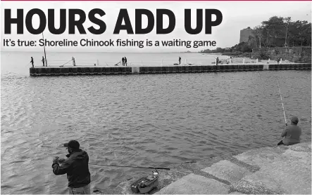  ?? DALE BOWMAN/SUN-TIMES ?? Patient anglers line both sides of the mouth of Jackson Park Harbor, where Chinook are being caught this month.