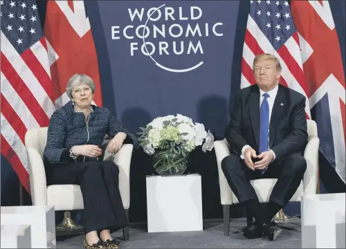  ?? PICTURE: AP PHOTO. ?? DAVOS TALKS: Prime Minister Theresa May and US president Donald Trump pledged to work together to boost trade during a meeting at the World Economic Forum.