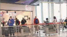  ?? Lori Van Buren / Times Union ?? Passengers wait in line at the Albany Internatio­nal Airport at Chick-fil-a on Wednesday.