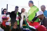  ??  ?? President Cyril Ramaphosa ( 2nd from left) is joined by Gandhi look- alike Harshvardh­an Pitambar and Reverend Jesse Jackson to lead 33rd gandhi Walk in Lenasia, Johannesbu­rg, on Sunday.