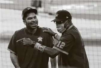  ?? KarenWarre­n / Staff photograph­er ?? Astros manager Dusty Baker jokes with pitcher Jose Urquidy before a game this month. Urquidy, who started Game 5 of last year’sWorld Series as a rookie, could get a start against Minnesota.