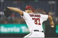  ?? The Associated Press ?? SPECIAL DELIVERY: Washington Nationals starting pitcher Stephen Strasburg throws to the Miami Marlins in the eighth inning of Wednesday’s game in Washington. Strasburg struck out 14 batters in 7 1/3 innings to lead the Nationals to a 3-1 win over the Marlins.