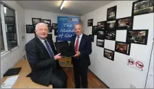  ??  ?? Frank Hayes of Kerry Group looks over the Denny site map with Michael Scannell of Kerry County Council .