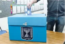  ?? (Marc Israel Sellem/The Jerusalem Post) ?? A MAN votes in the March 2 elections.