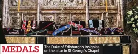  ??  ?? MEDALS
The Duke of Edinburgh’s Insignias on the altar in St George’s Chapel